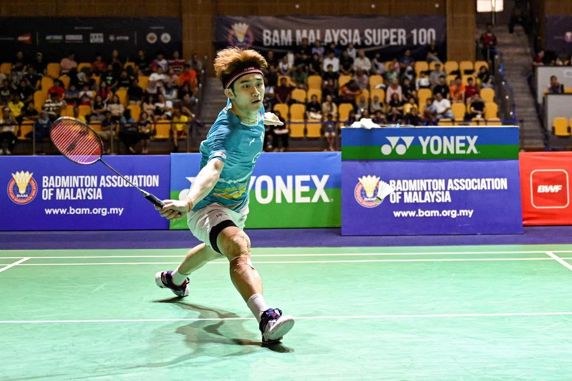 Singapore's Jia Heng Jason Teh hits a return against Taiwan's Chi Yu Jen in their final men's singles match at the Malaysia Badminton Super 100 in Kuala Lumpur on October 20, 2024. (Photo by Mohd RASFAN / AFP)