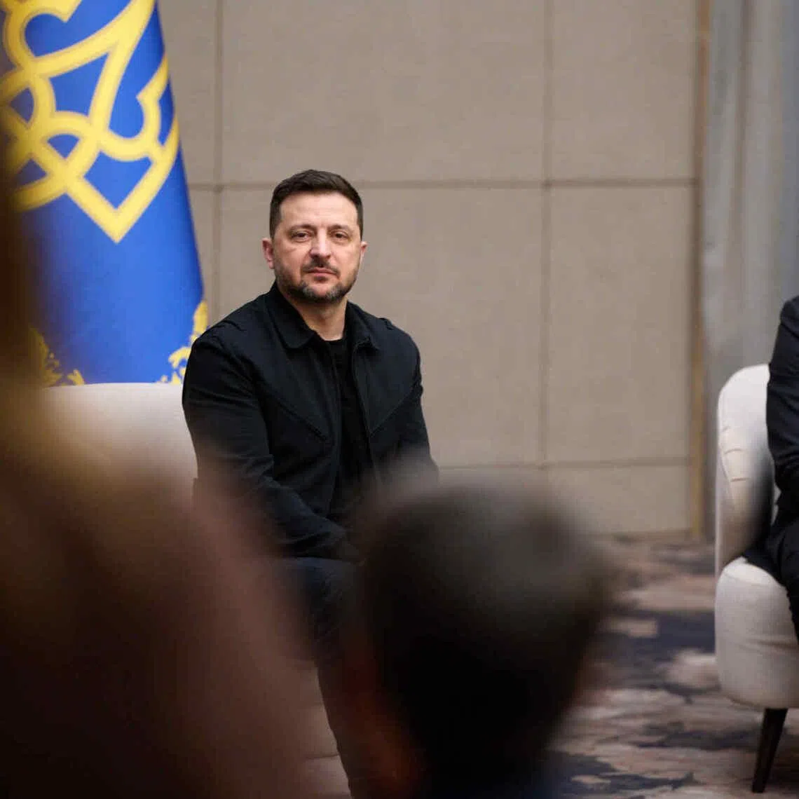 Ukrianian President Volodymyr Zelensky (left) taking questions during a visit to Ukraine's western Zakarpattia region on April 9.