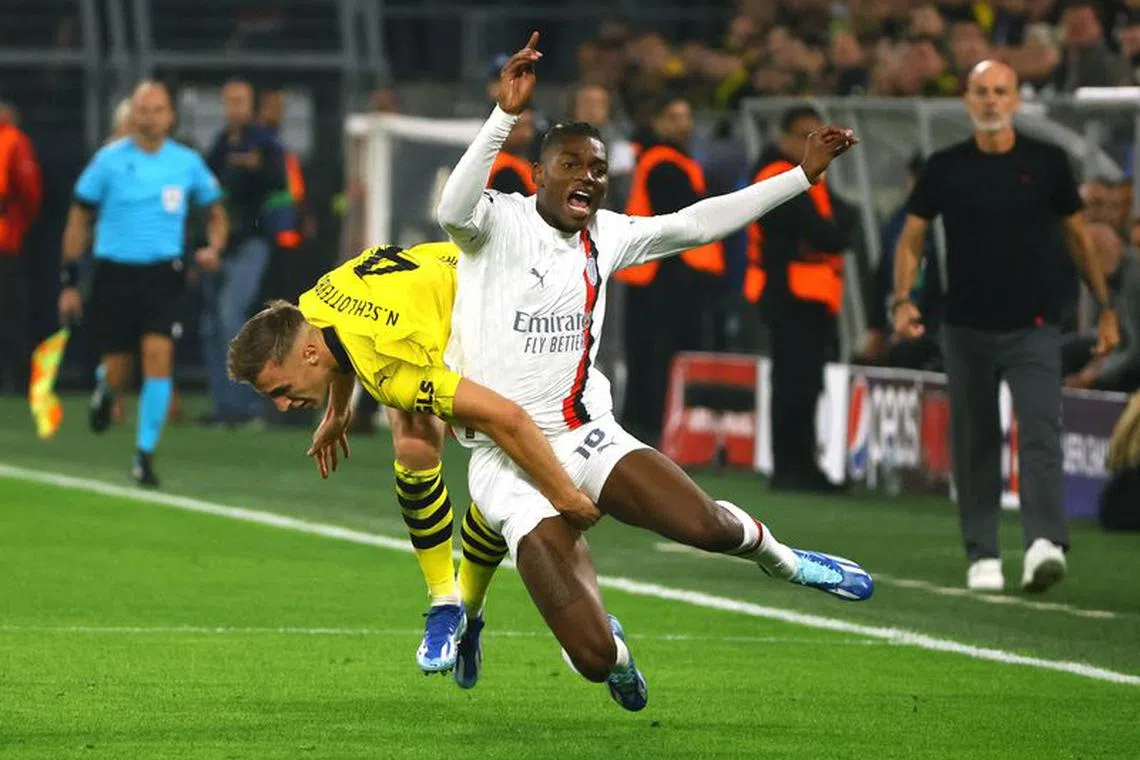 Soccer Football - Champions League - Group F - Borussia Dortmund v AC Milan - Signal Iduna Park, Dortmund, Germany - October 4, 2023 Borussia Dortmund&#039;s Nico Schlotterbeck in action with AC Milan&#039;s Rafael Leao REUTERS/Wolfgang Rattay