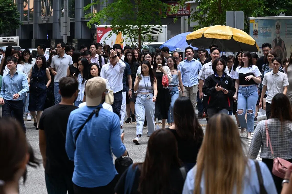 Generic photo of office workers at Raffles Place taken on Sept 26, 2025. Can be used for business, PMET, manpower, labour stories.
