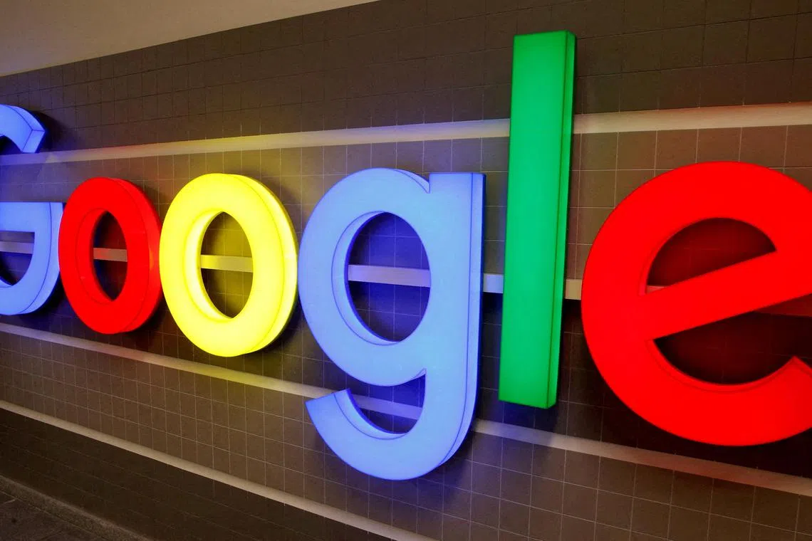 FILE PHOTO: An illuminated Google logo is seen inside an office building in Zurich, Switzerland December 5, 2018.    REUTERS/Arnd Wiegmann/File Photo