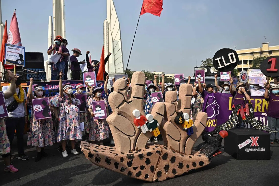 Thai labour unions, state enterprises and women’s rights activists prepare to march on International Women’s Day in Bangkok on March 8, 2023. 