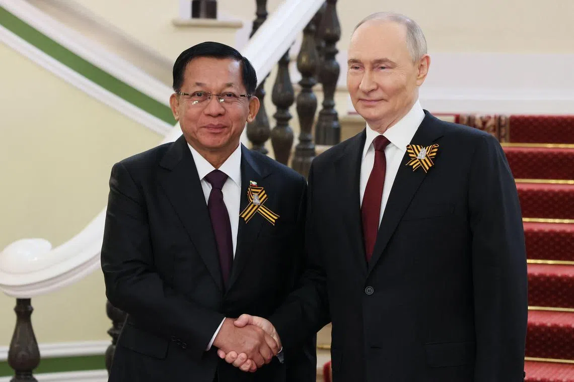 In this pool photograph distributed by the Russian state agency Sputnik, Russia's President Vladimir Putin greets Myanmar junta leader Min Aung Hlaing prior to the Victory Day military parade in Moscow on May 9, 2025. Russia celebrates the 80th anniversary of the Soviet Union's victory over Nazi Germany in World War Two (WWII). (Photo by Mikhail METZEL / POOL / AFP)