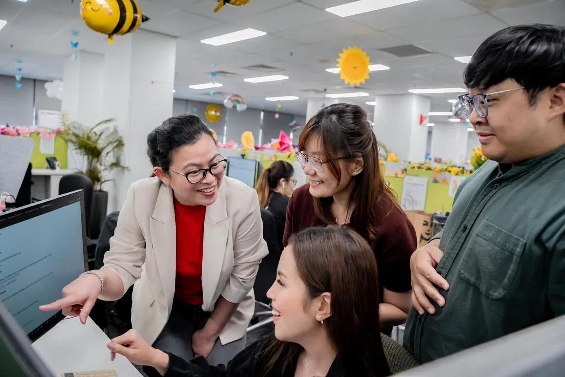 Nura Shereen Nordin (left) saves around 20 working hours each month through the use of AI tools.