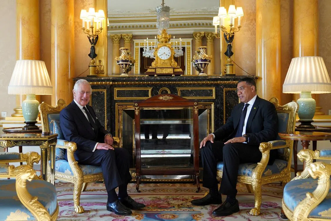 FILE PHOTO: King Charles III speaks with Prime Minister of Jamaica, Andrew Holness, as he receives realm prime ministers in the 1844 Room at Buckingham Palace in London. Picture date: Saturday September 17, 2022. Stefan Rousseau/Pool via REUTERS/File Photo