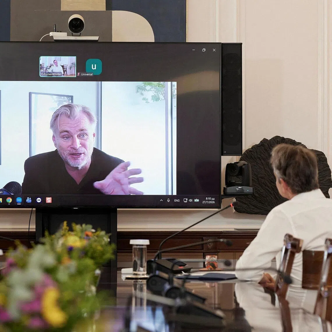 The Odyssey director Christopher Nolan talking to Greek Prime Minister Kyriakos Mitsotakis during a video call, in Athens, Greece, on July 28.