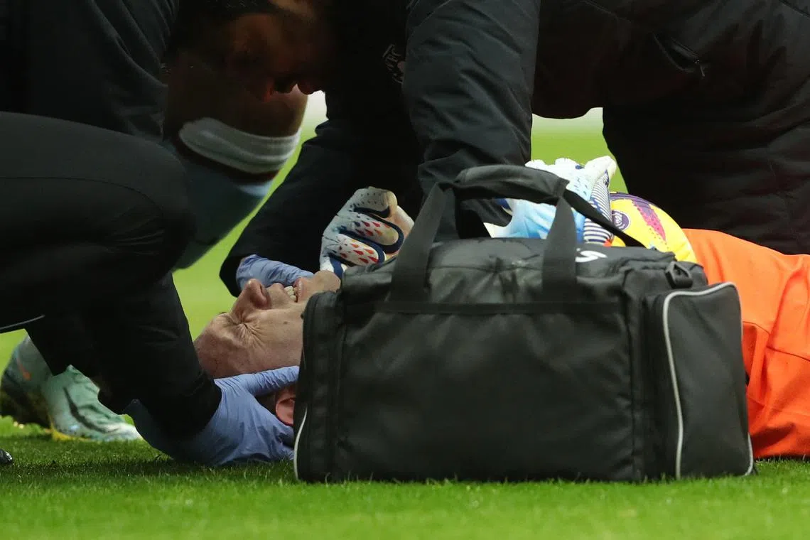 Aston Villa goalkeeper Emiliano Martinez receiving medical attention after sustaining a head injury in the game against Newcastle United on Saturday. 