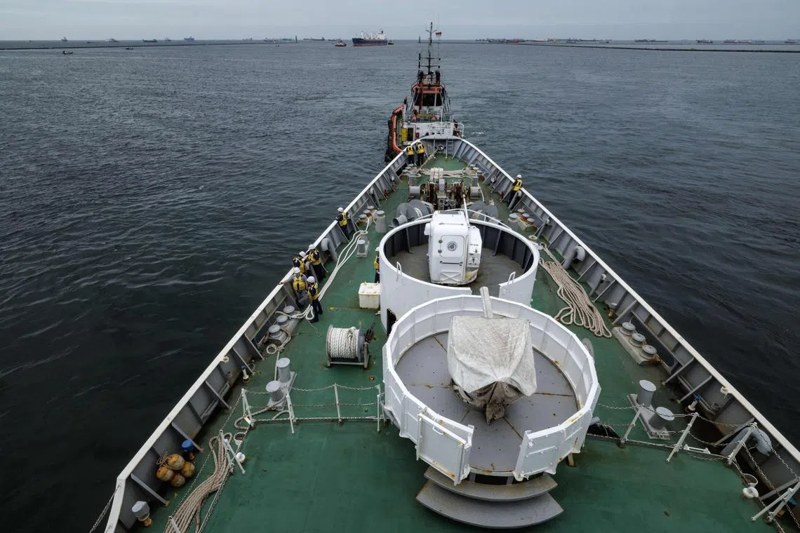 A 35mm gun (front) and a 20mm gun are pictured on the Japan Coast Guard patrol vessel Settsu during joint anti-piracy exercises with the Indonesia Coast Guard on January 24, 205.