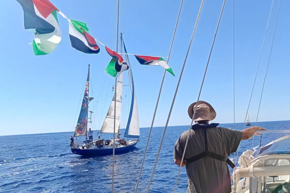 A handout image of the boat named Ahed Tamimi sailing in the waters off the island of Crete, which is to join the Global Sumud Flotilla that has come under drone attack while trying to deliver aid to Gaza and break Israel's naval blockade, as seen from the boat Vangelis Pissias, September 25, 2025. March To Gaza Greece/Handout via REUTERS