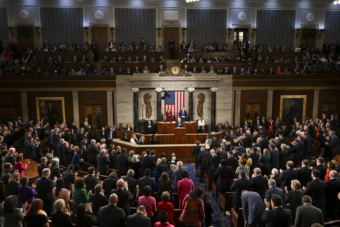 President Joe Biden delivers his State of the Union address, with House Speaker Kevin McCarthy (R-Calif.) and Vice President Kamala Harris standing behind him, to a joint session of Congress, at the Capitol in Washington on Tuesday, Feb. 7, 2023. (Kenny Holston/The New York Times)