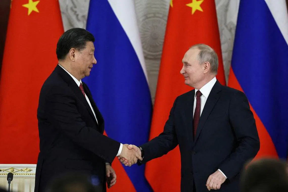 FILE PHOTO: Russian President Vladimir Putin shakes hands with Chinese President Xi Jinping during a signing ceremony following their talks at the Kremlin in Moscow, Russia March 21, 2023. Sputnik/Mikhail Tereshchenko/Pool via REUTERS/File Photo