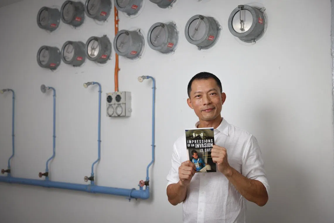 aeinvasion25 ST20230525_202374944060 Ong Wee Jin / Alexandria Ee  /

Ix Shen unveils his autobiography, "Impressions of an Invasion: A Correspondent in Ukraine" within the confines of a secret bunker.

Photographed on May 25, 2023.