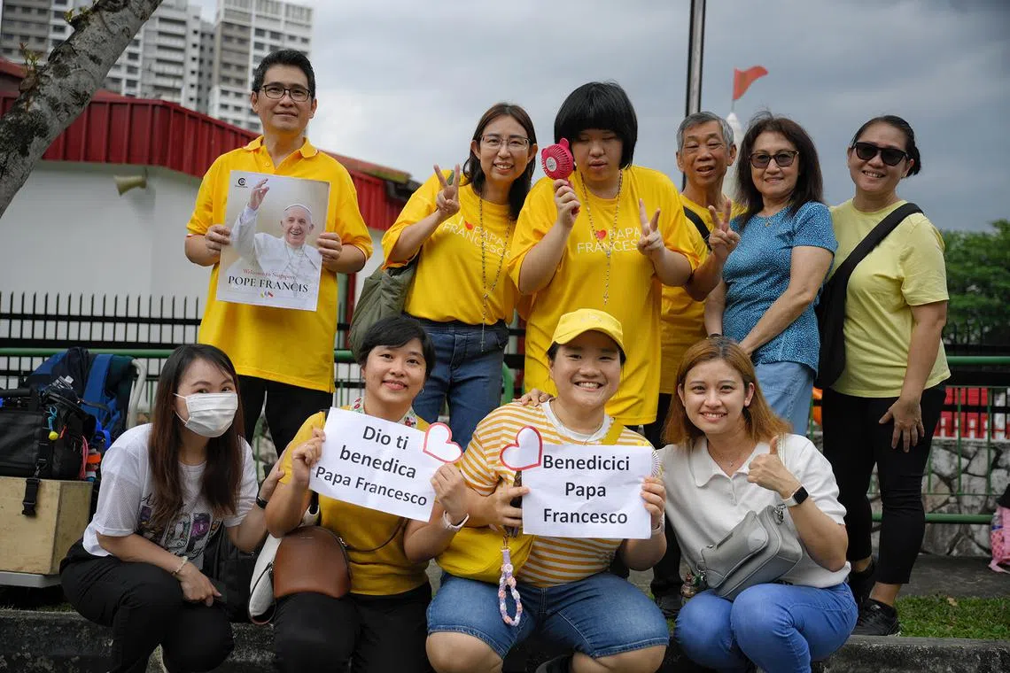 A group of close friends, all of who are Catholic and who stay in the Hougang, Sengkang and Punggol area, gathered with around 20 other members of the public along Ponggol Seventeenth Avenue at around 2.45pm, near the St. Francis Xavier Retreat Centre where the Pope will be staying. 