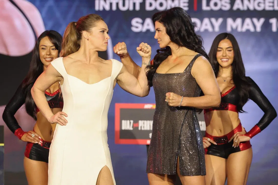 Ronda Rousey and Gina Carano pose after the press conference for the Most Valuable Promotions MMA card at Palladium Theater. 