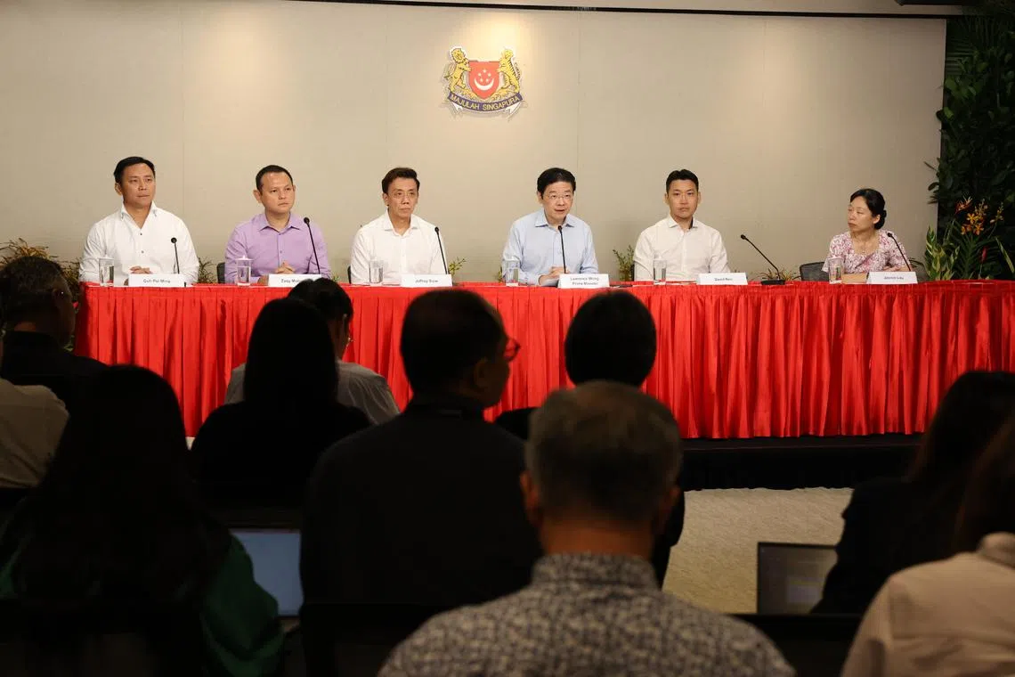 PM Lawrence Wong (third from right) announcing a Cabinet reshuffle at a press conference on July 22. With him are (from left) Goh Pei Ming, Zaqy Mohamad, Jeffrey Siow, David Neo and Jasmin Lau.
