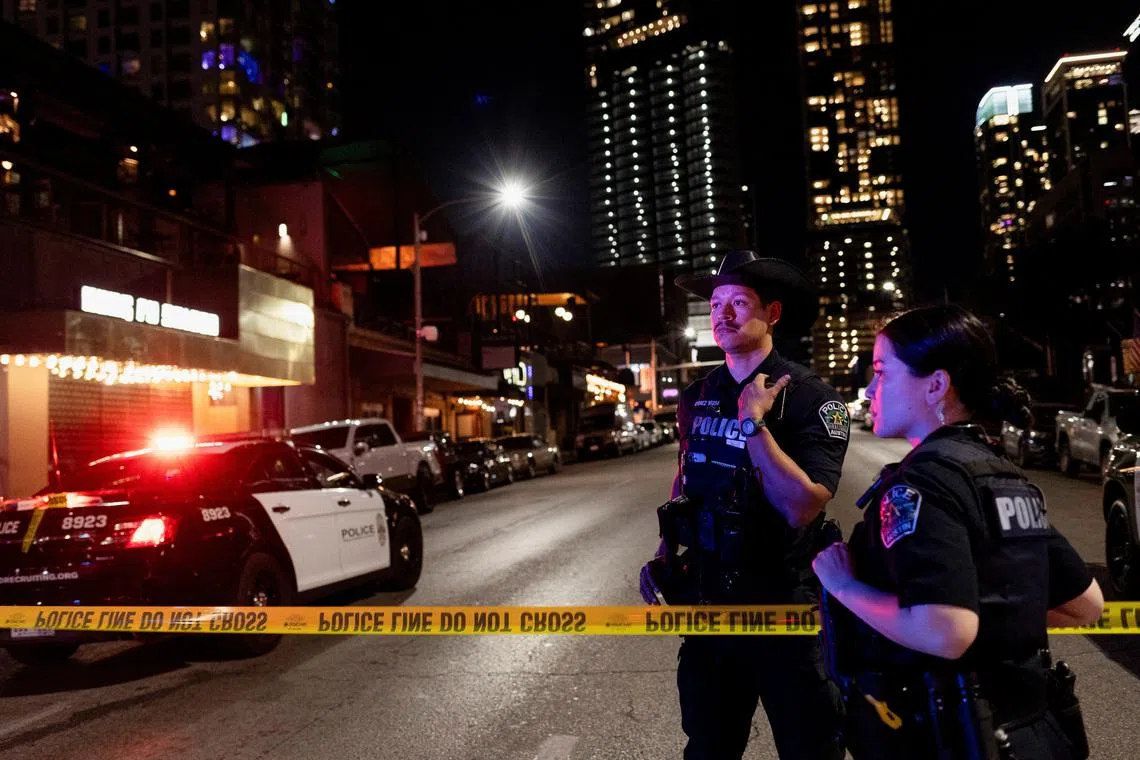 Austin police officers work at the scene after a deadly mass shooting outside Buford's, a popular roadhouse-style bar in Austin, Texas, U.S. March 1, 2026. REUTERS/Nuri Vallbona