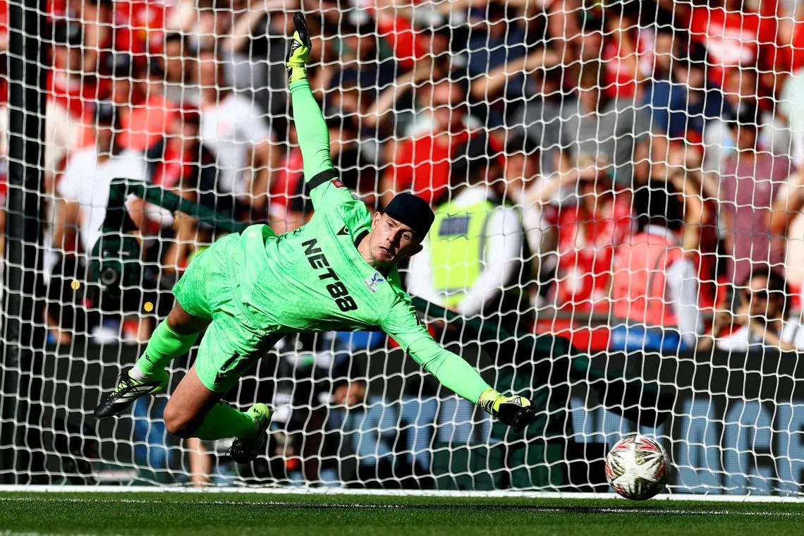 Crystal Palace's Dean Henderson saving a penalty by Liverpool's Alexis Mac Allister as the Eagles prevailed 3-2 in the shootout.