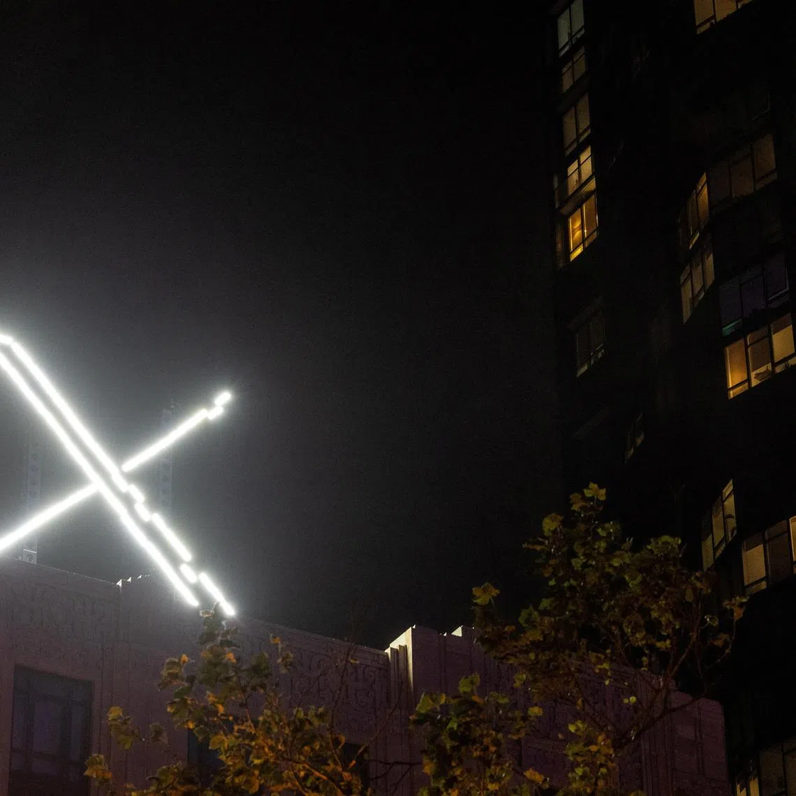 FILE PHOTO: 'X' logo is seen on the top of the headquarters of the messaging platform X, formerly known as Twitter, in downtown San Francisco, California, U.S., July 30, 2023. REUTERS/Carlos Barria/File Photo