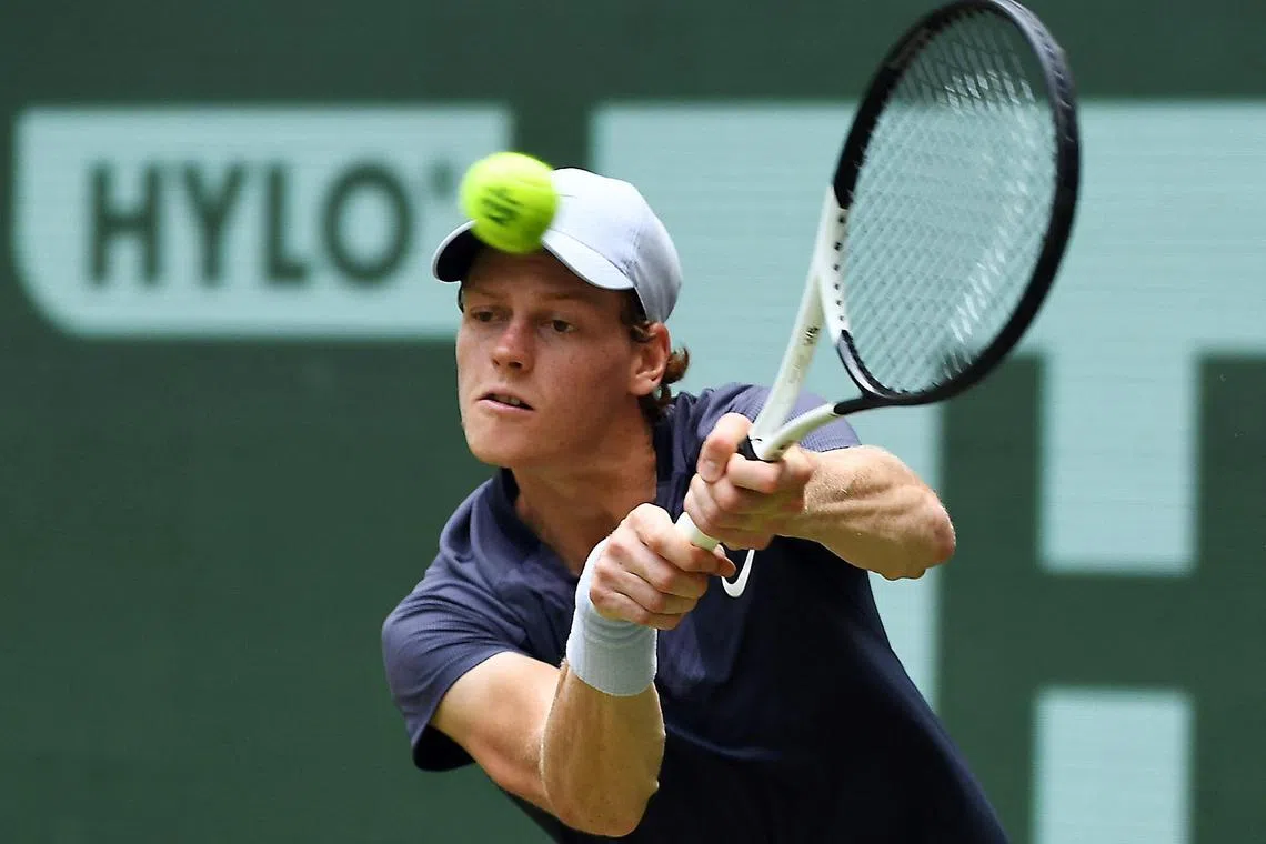 Italy's Jannik Sinner in action against compatriot Lorenzo Sonego.