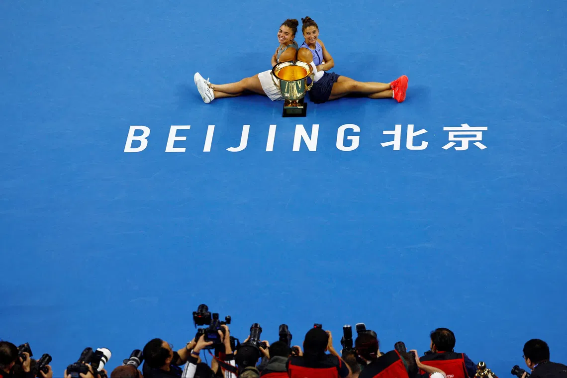 Italy's Sara Errani and Jasmine Paolini celebrating with the winners' trophy after winning their final doubles match against Japan's Miyu Kato and Hungary's Fanny Stollar at the China Open, held at the Beijing Olympic Green Tennis Center, in Beijing, China, on Oct 5, 2025.