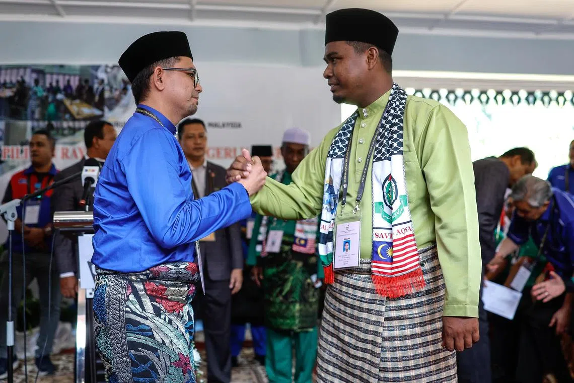 The Aug 17 Nenggiri by-election will see Perikatan Nasional's Mr Mohd Rizwadi Ismail (right) standing against Umno district youth chief Mohd Azmawi Fikri Abdul Ghani.
