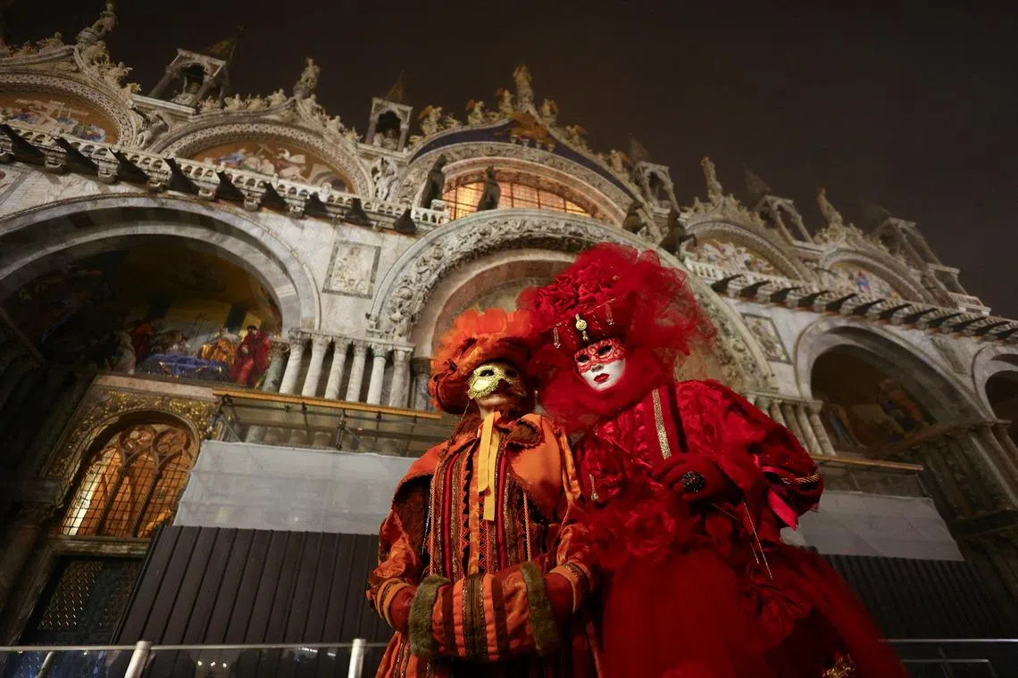 Masked revellers takinh part in the Venice carnival in St. Mark's Square in Venice, Italy, Jan 27, 2024. 