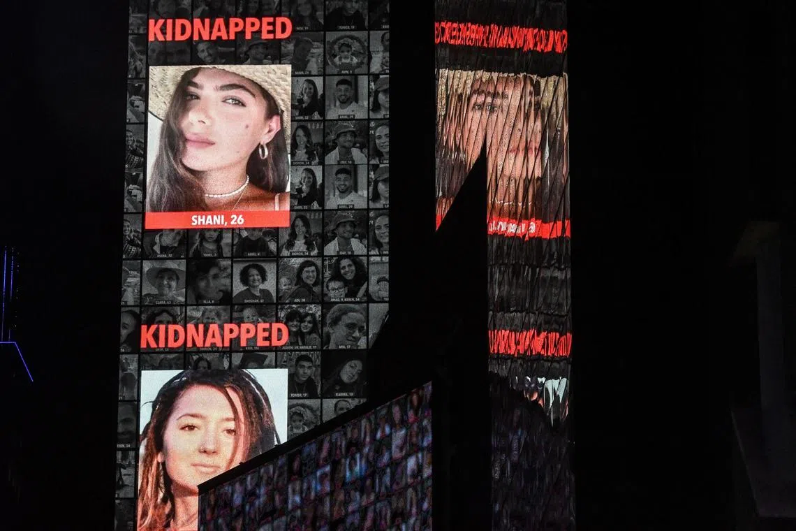 Billboards in Times Square display faces of hostages in Gaza held by Hamas operatives during a rally in New York on Oct. 19, 2023.