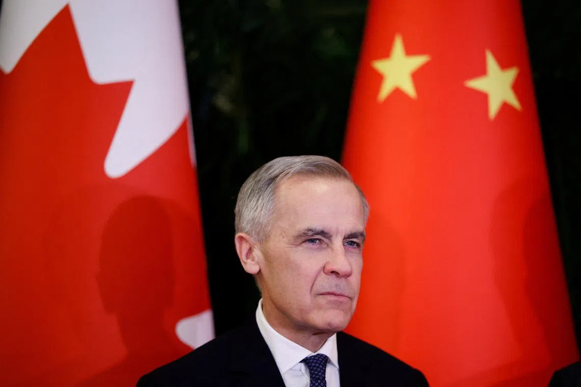 Canada's Prime Minister Mark Carney looks on as he meets the Chairman of the Standing Committee of the National People's Congress of China Zhao Leji (not pictured), during the first visit by a Canadian Prime Minister to China since 2017, at the Great Hall of the People, in Beijing, China, January 15, 2026. REUTERS/Carlos Osorio