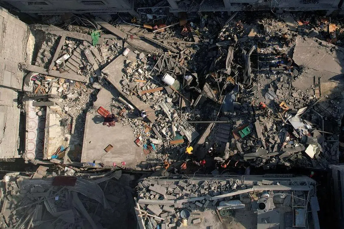 A view shows the ruins of Palestinian houses hit by Israeli strikes at al-Shati (Beach) refugee camp, in Gaza City, October 12, 2023. REUTERS/Mohammed Fayq Abu Mostafa