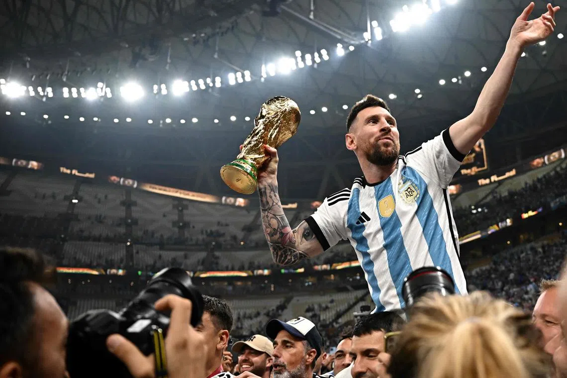 Argentina captain Lionel Messi lifting the World Cup trophy after a thrilling final against France.