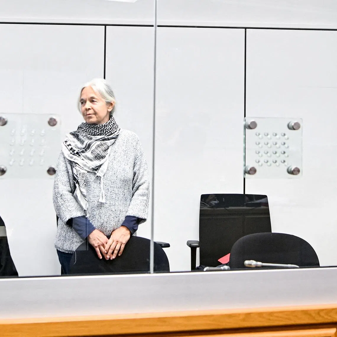 FILE PHOTO: Daniela Klette, former member of German far-left militant group The Red Army Faction (RAF), accompanied by her lawyers Lukas Theune and Undine Weyers, attends another day of her trial at the Celle higher regional court, in Celle, Germany, May 6, 2025. Fabian Bimmer/Pool via REUTERS/File Photo