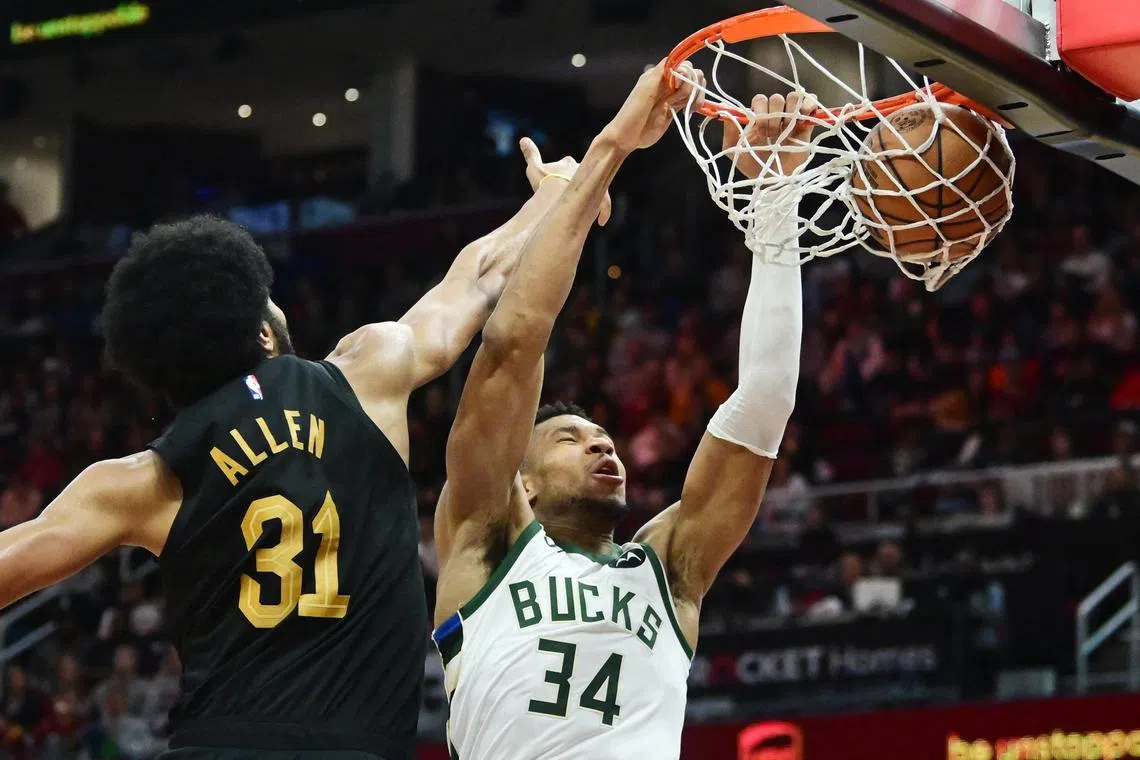 Milwaukee Bucks forward Giannis Antetokounmpo dunks as Cleveland Cavaliers centre Jarrett Allen defends during the second half at Rocket Mortgage FieldHouse.