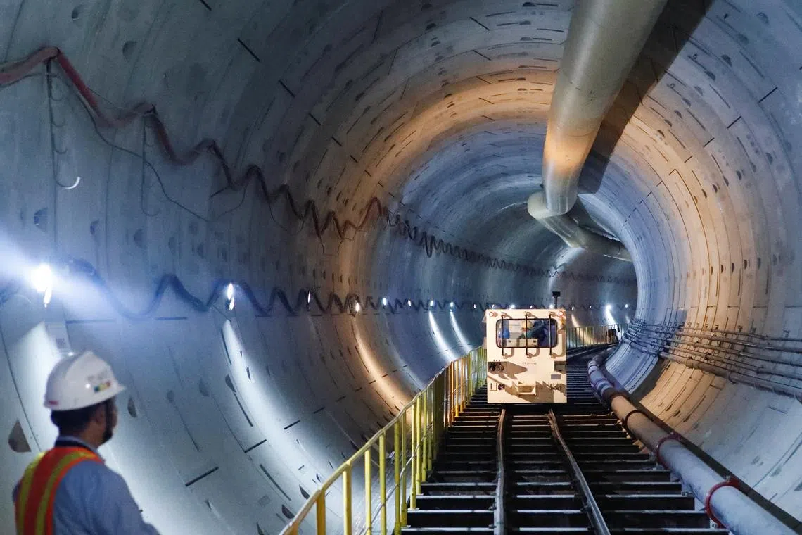A construction worker standing in an underground MRT (Mass Tapid Transit) system tunnel in Jakarta, Indonesia, on Sept 20, 2022. 
