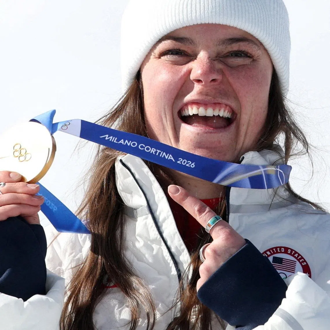 Milano Cortina 2026 Olympics - Alpine Skiing - Women's Downhill Victory Ceremony - Tofane Alpine Skiing Centre, Belluno, Italy - February 08, 2026. Gold medallist Breezy Johnson of United States celebrates on the podium after winning the women's downhill REUTERS/Leonhard Foeger