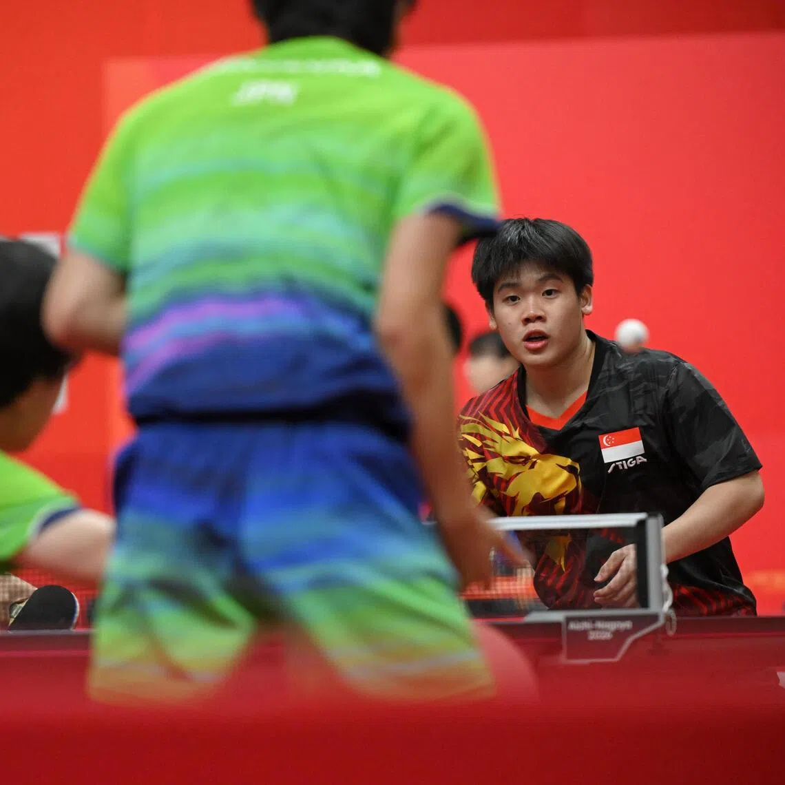 Izaac Quek (right) and Koen Pang of Singapore in action against Tomokazu Harimoto and Hiroto Shinozuka of Japan during the Asian Games table tennis men’s doubles quarter-finals at Sky Hall Toyota on Sept 26.