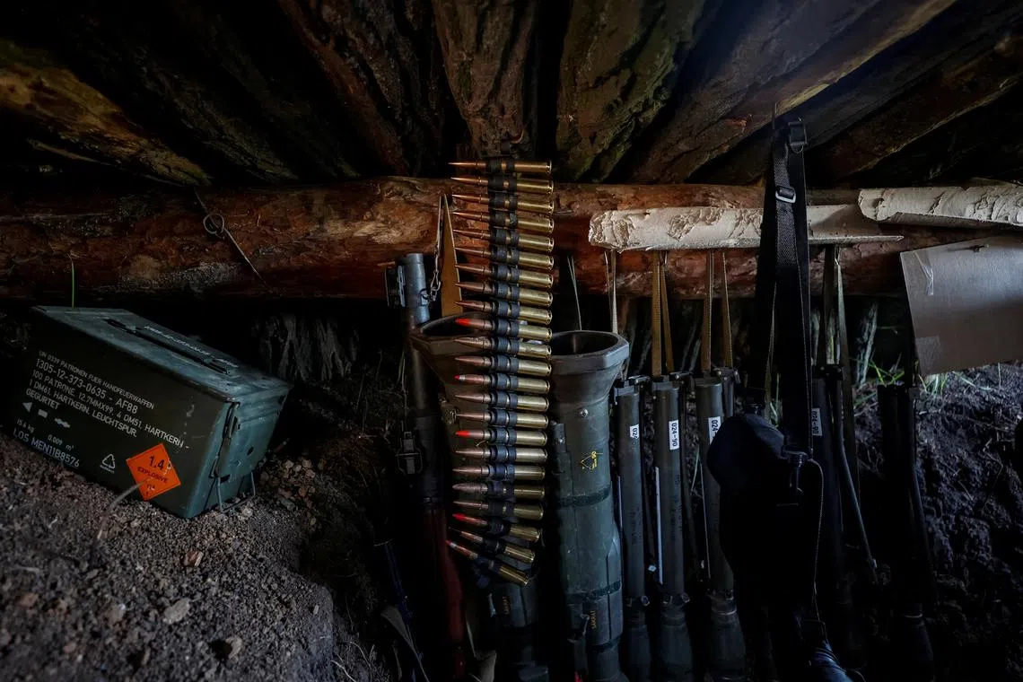 FILE PHOTO: Weapons of Ukrainian service members are seen in a trench at position at a front line, amid Russia's attack on Ukraine, in Donetsk region, Ukraine May 5, 2023. Ukraine Radio Free Europe/Radio Liberty/Serhii Nuzhnenko via REUTERS/File Photo