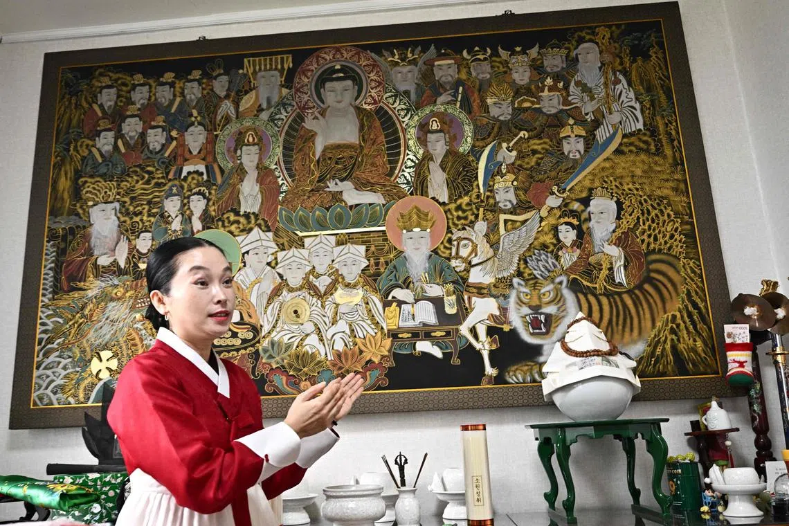 Shaman Yang Su-bong, standing in front of her altar, said the outcome of the upcoming presidential election in South Korea on June 3 came to her in visions years ago.