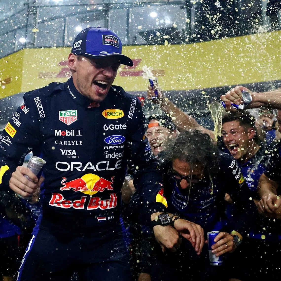 Red Bull’s Max Verstappen celebrating with his teammates after winning the Bahrain Grand Prix at Malaysia’s Sepang International Circuit on Oct 4.