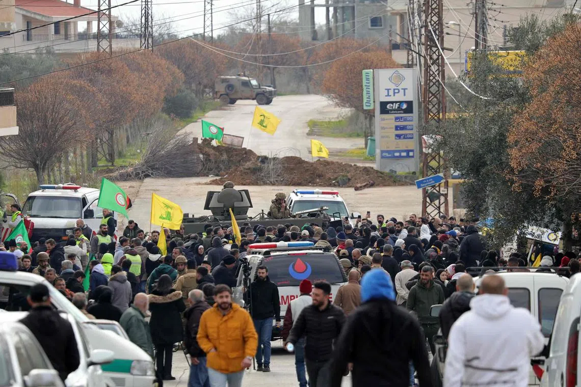 Israeli on a road leading to Kfar Kila village in southern Lebanon, where displaced residents are gathered in the hope of returning to their homes.