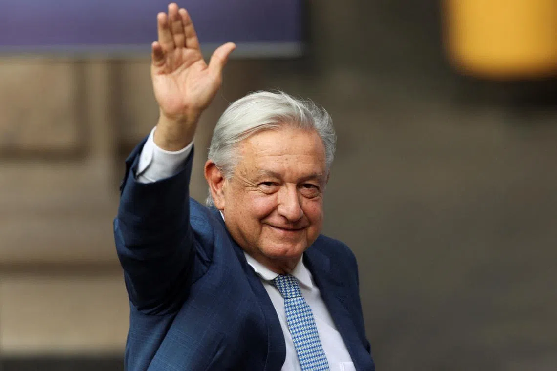 FILE PHOTO: Mexico's President Andres Manuel Lopez Obrador waves during a ceremony with athletes, ahead of the Paris 2024 Olympic Games, at the National Palace in Mexico City, Mexico, June 11, 2024. REUTERS/Luis Cortes/File Photo