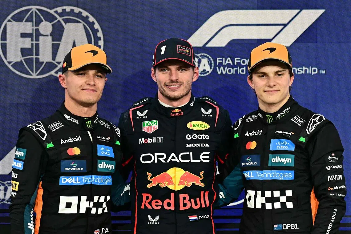 Red Bull pole sitter Max Verstappen (centre), with McLaren teammates Lando Norris (left) and Oscar Piastri after qualifying.