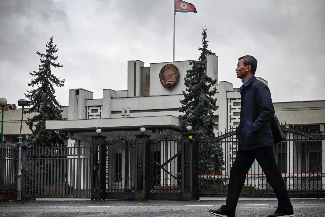 A man walking past the North Korean embassy in Moscow on Oct 31. Pyongyang has sent thousands of troops to reinforce Russia’s war effort, including to the Kursk border region, where Ukrainian forces seized territory earlier this year.