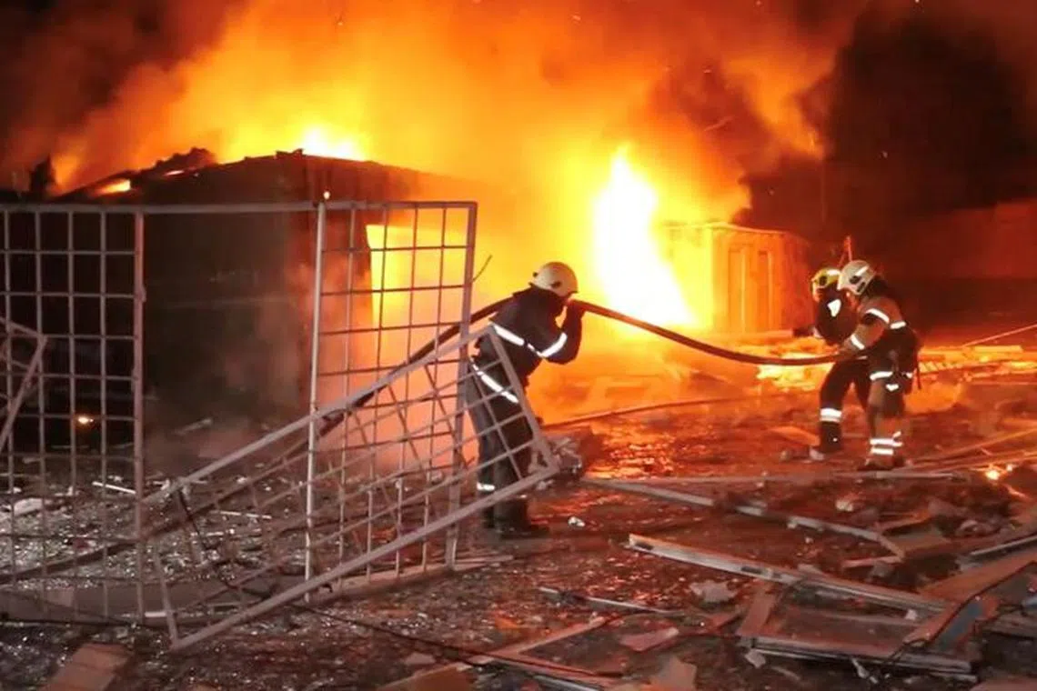 Emergency personnel work to put out a fire following a drone attack, amid Russia's attack on Ukraine, in Kharkiv, Ukraine in this screengrab obtained from a video released on January 31, 2024. State Emergency Service of Ukraine/Handout via REUTERS    THIS IMAGE HAS BEEN SUPPLIED BY A THIRD PARTY. NO RESALES. NO ARCHIVES. MANDATORY CREDIT.