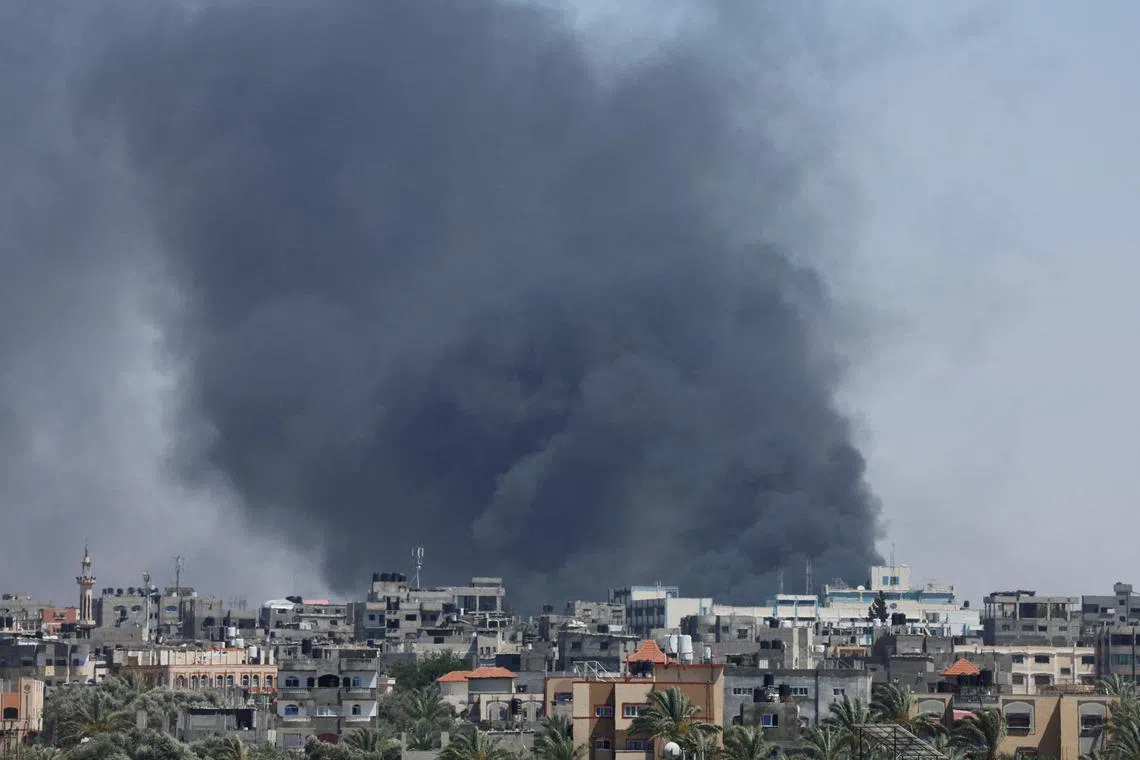 FILE PHOTO: Smoke rises during an Israeli air strike, amid the ongoing conflict between Israel and Hamas, in Rafah, in the southern Gaza Strip, May 24, 2024. REUTERS/Mohammed Salem/File Photo