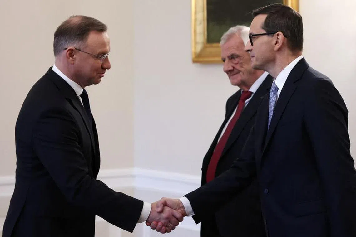 Polish President Andrzej Duda meets with Polish Prime Minister Mateusz Morawiecki and Deputy Speaker of the Parliament Ryszard Terlecki, both from Law and Justice, during consultations with the leaders of the two main parties in the newly elected parliament, Law and Justice and Civic Platform, at the Presidential Palace in Warsaw, Poland, October 24, 2023. REUTERS/Kacper Pempel/File Photo