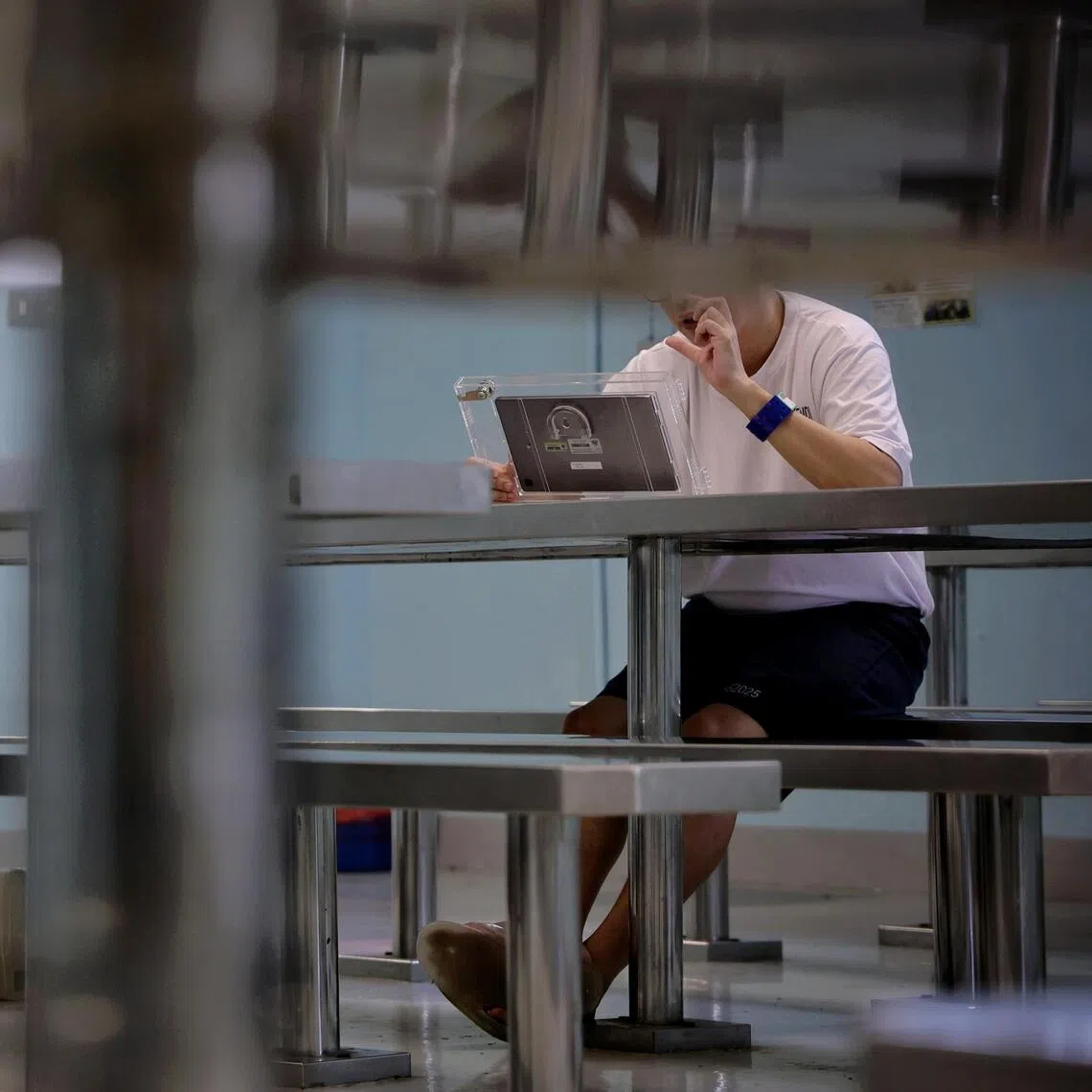 Fai (not his real name), who is currently serving his sentence of 10 years and four weeks, speaking to his 15-year-old daughter over a video call in Changi Prison on Oct 22.