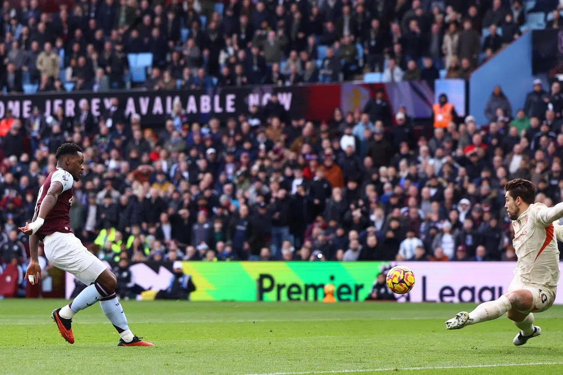 Aston Villa's Jhon Duran scores past Manchester City's Stefan Ortega in their Premier League clash.