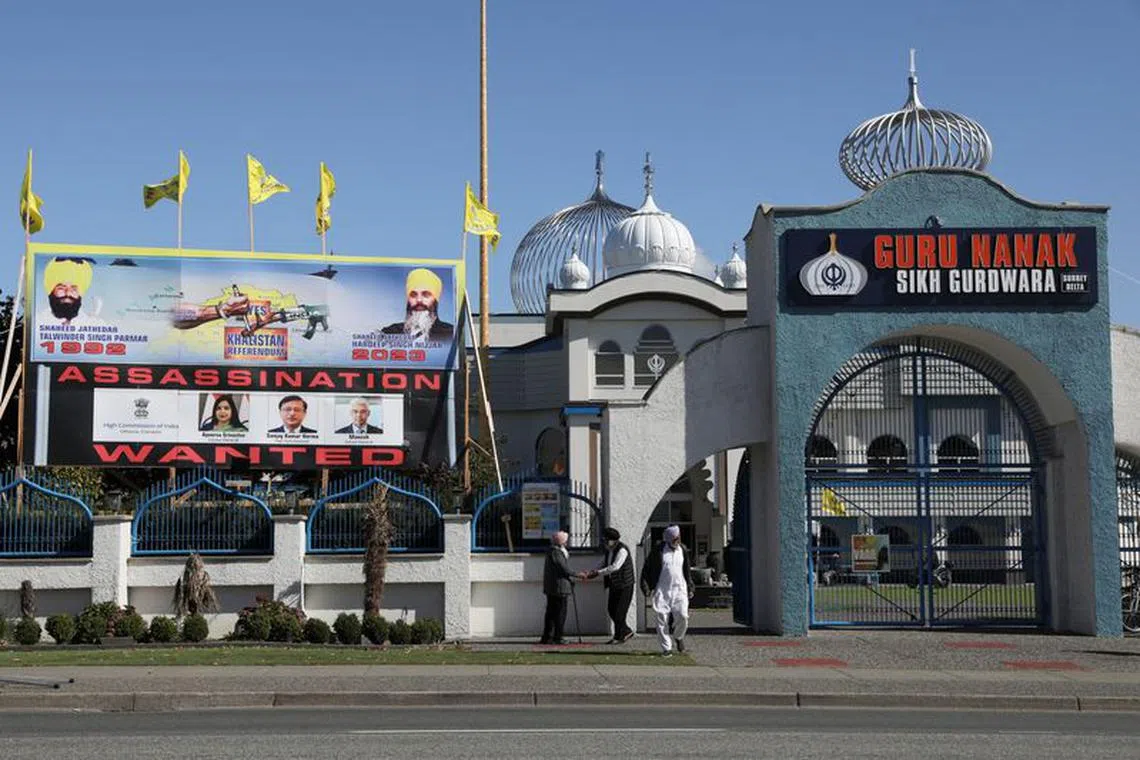 FILE PHOTO: A sign outside the Guru Nanak Sikh Gurdwara temple is seen after the killing on its grounds in June 2023 of Sikh leader Hardeep Singh Nijjar, in Surrey, British Columbia, Canada September 18, 2023.  REUTERS/Chris Helgren