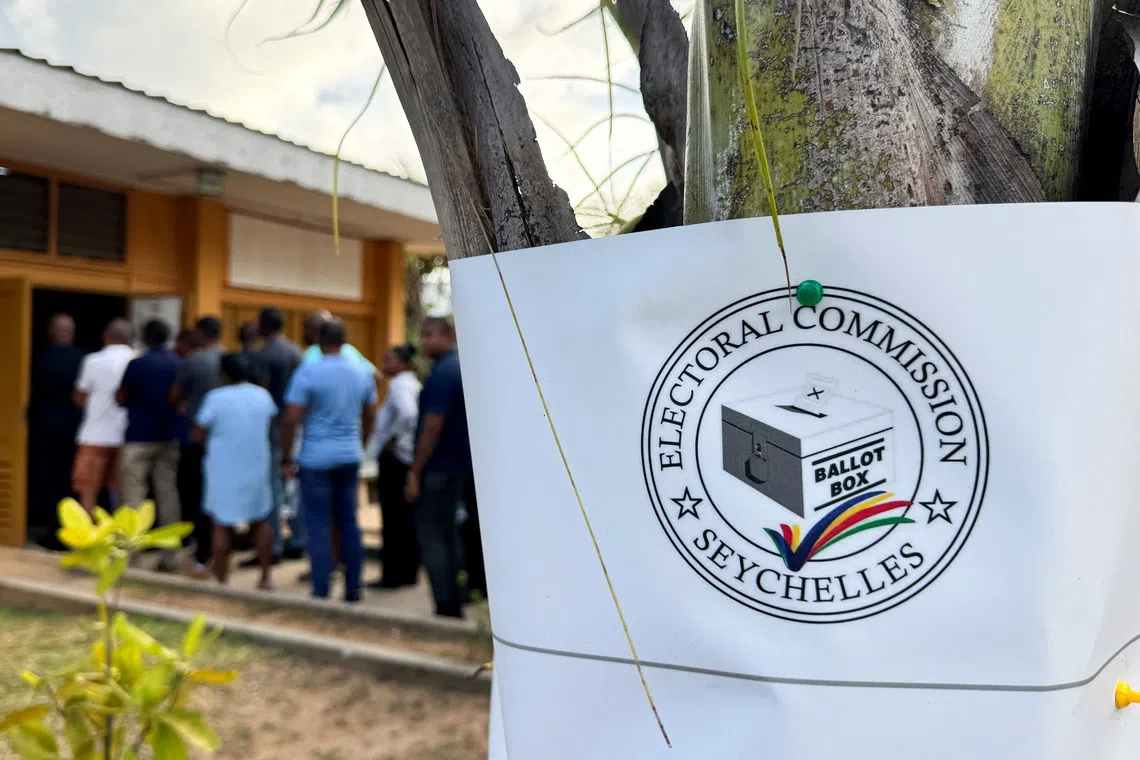 People gather to cast their ballots during the presidential runoff election, after no candidate secured the required 50% majority in the first round held on September 27, in Victoria, Seychelles, October 9, 2025. REUTERS/Gabriel Robert-Gironcelle