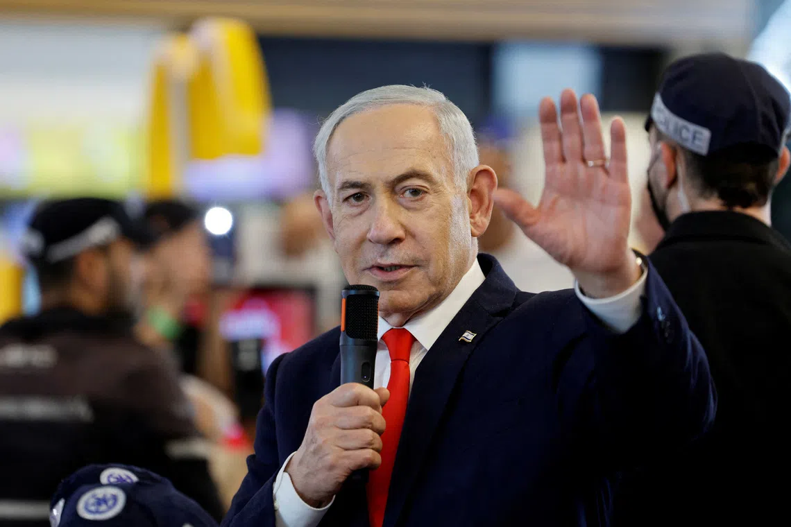 Israeli Prime Minister Benjamin Netanyahu meeting members of the public at a mall in Ramla on Oct 19, ahead of Israel’s national election.